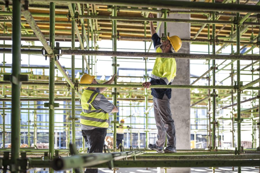 Construction workers on scaffolding
